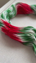 Load and play video in Gallery viewer, OOAK Variant of It’s Beginning to Look a Lot Like Christmas (Trial 17) Hand Dyed Merino Wool, Cashmere and Nylon Superwash Sock/Fingering Yarn