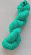 Load and play video in Gallery viewer, Did you know that there’s a tunnel under Ocean Blvd Hand Dyed Superwash Merino Wool, Cashmere & Recycled Nylon Sock Yarn
