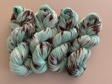 Load image into Gallery viewer, Melting (Mint Chocolate Chip Ice Cream) Hand Dyed Superwash 100% Merino Wool Sport Yarn