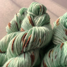 Load image into Gallery viewer, Melting (Mint Chocolate Chip Ice Cream) Hand Dyed Non-Superwash Merino & Camel Aran Yarn
