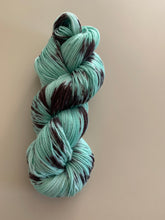 Load image into Gallery viewer, Melting (Mint Chocolate Chip Ice Cream) Hand Dyed Superwash Merino Wool &amp; Nylon Sock Yarn
