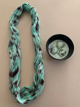 Load image into Gallery viewer, Melting (Mint Chocolate Chip Ice Cream) Hand Dyed Superwash Merino Wool &amp; Nylon Sock Yarn
