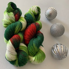 Load image into Gallery viewer, Mistletoe and Holly Hand Dyed Sparkly Superwash Merino Wool &amp; Nylon Sock Yarn
