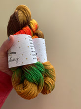 Load image into Gallery viewer, Cheeseburger in Paradise Hand Dyed Superwash Merino Wool, Cashmere &amp; Nylon Sock Yarn
