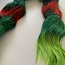 Load image into Gallery viewer, Mistletoe and Holly Hand Dyed Sparkly Superwash Merino Wool &amp; Nylon Sock Yarn
