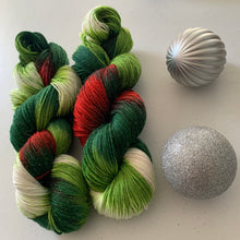 Load image into Gallery viewer, Mistletoe and Holly Hand Dyed Sparkly Superwash Merino Wool &amp; Nylon Sock Yarn
